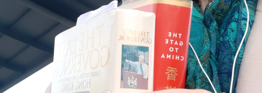 woman holding two books