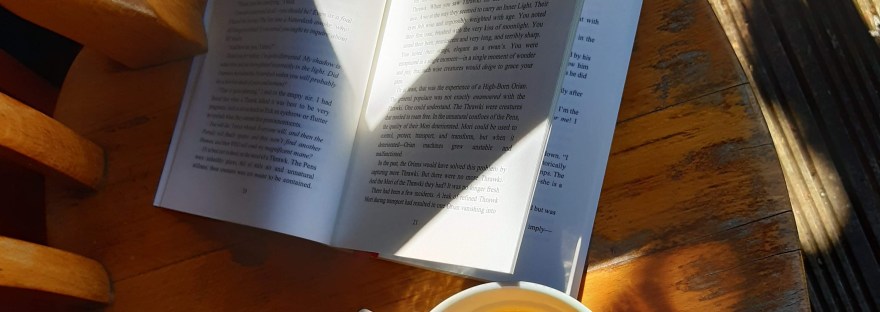 book and tea on a chair